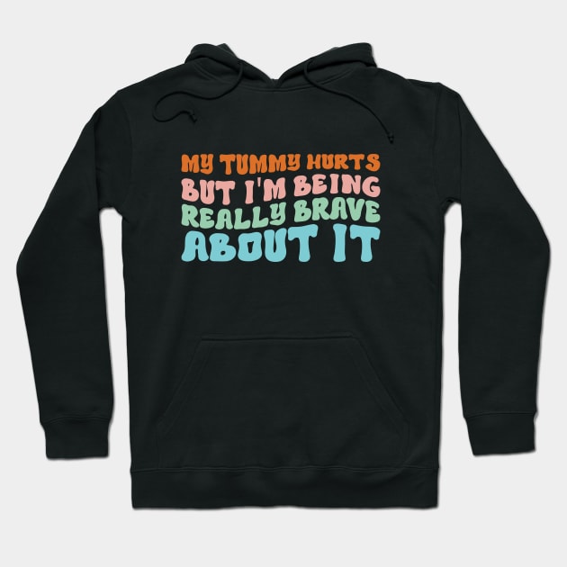 My Tummy Hurts But I'm Being Really Brave About It Groovy Hoodie by Merchby Khaled